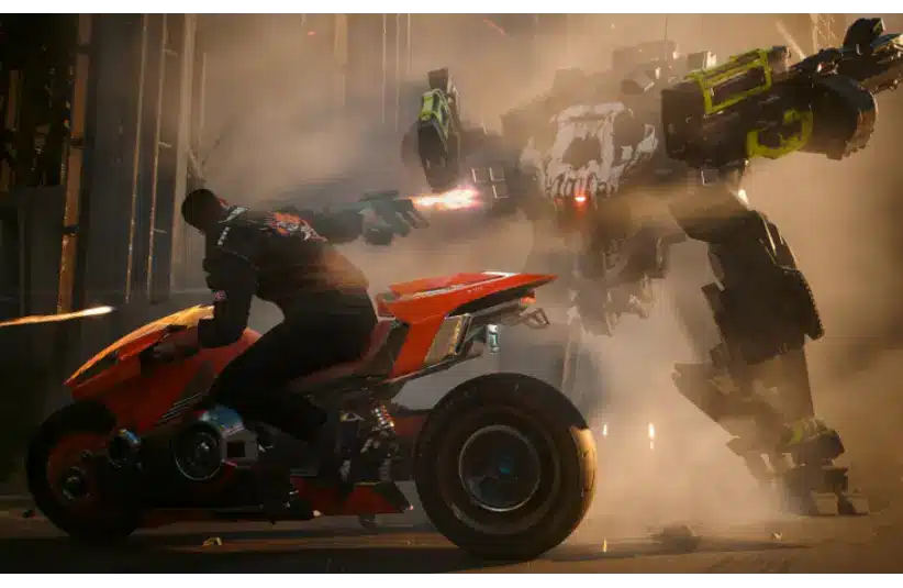 A person on a red futuristic motorcycle speeds away from a giant robotic figure. Sparks fly and smoke billows, creating a tense, action-packed scene. Cyberpunk 2077: Phantom Liberty, Courtesy of CD PROJEKT RED.