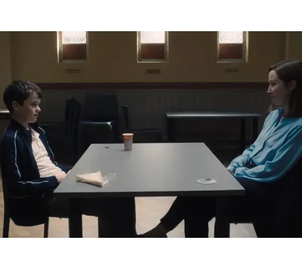 Eric Doherty, pictured with co-star Owen Cooper in a scene at a table in the Netflix series "Adolescence," won Best Performance by a Female Actor in a Supporting Role on Television at the 2026 Golden Globes.