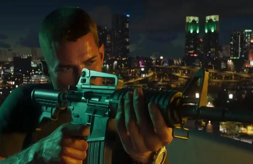 Character from Rockstar's GTA 6 holding a rifle on a rooftop at night, with a city skyline illuminated by colorful lights in the background, conveying tension and focus.