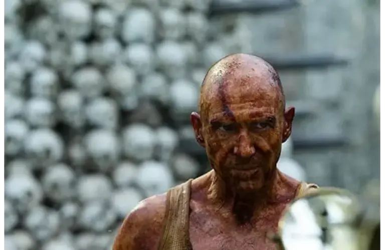 Dr. Kelson (Ralph Fiennes) in the bone temple in 28 Years Later, Courtesy of Sony Pictures Entertainment