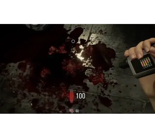 Grace's hand is holding a device next to a dark, bloody floor in Resident Evil Requiem. The scene is intense and somber, with a bright screen bar visible on the device, adding tension.