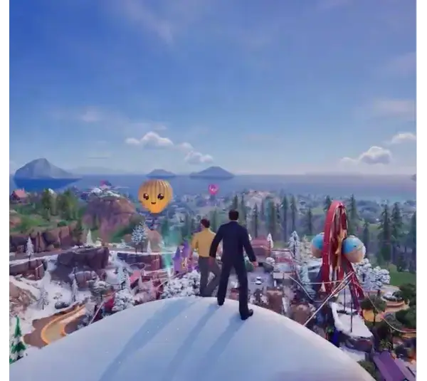 Two figures stand on a snowy hill, overlooking a vibrant amusement park with a Ferris wheel and cheerful hot air balloon under a clear blue sky. Fortnite The Office crossover