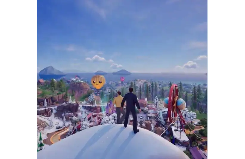 Two figures stand on a snowy hill, overlooking a vibrant amusement park with a Ferris wheel and cheerful hot air balloon under a clear blue sky. Fortnite The Office crossover