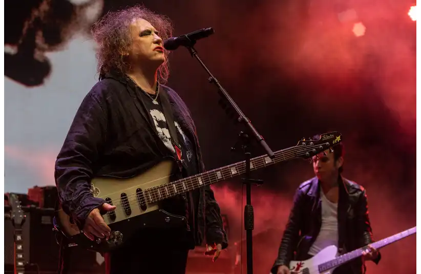 Robert Smith, left, lead singer of the Cure, performs alongside Simon Gallup at Pine Knob Music Theatre in Clarkston on Tuesday, June 13, 2023.