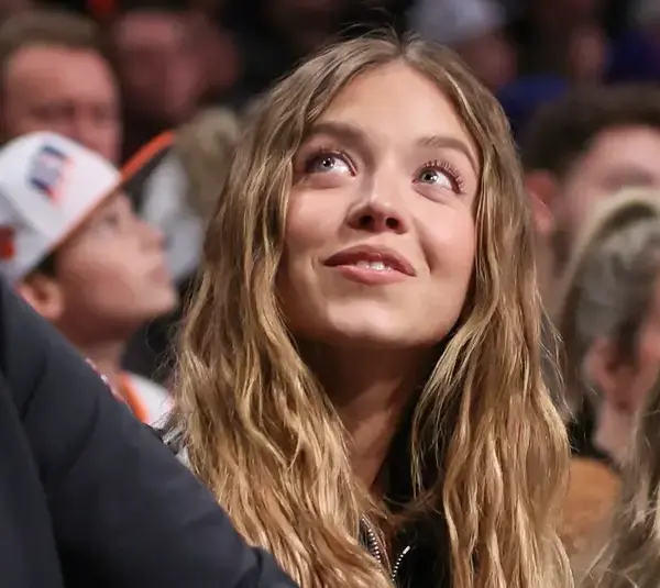Jan 21, 2025; Brooklyn, New York, USA; Actress Sydney Sweeney sits courtside during the game between the New York Knicks and the Brooklyn Nets at Barclays Center. Mandatory Credit: Wendell Cruz-Imagn Images