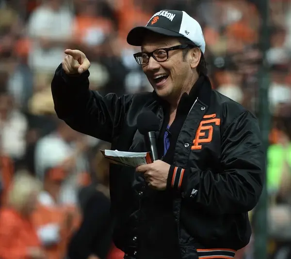 Oct 14, 2014; San Francisco, CA, USA; Film and television actor Rob Schneider cheers before game three of the 2014 NLCS playoff baseball game between the San Francisco Giants and the St. Louis Cardinals at AT&T Park. Mandatory Credit: Kyle Terada-Imagn Images