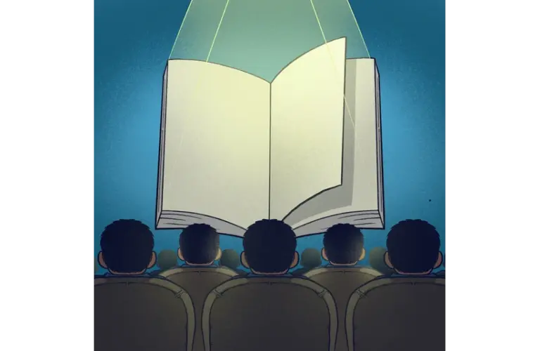 A group of people sitting in an audience watches a large, open book projected onto a screen. The scene conveys themes of learning and focus and YA books adaptations to movies.