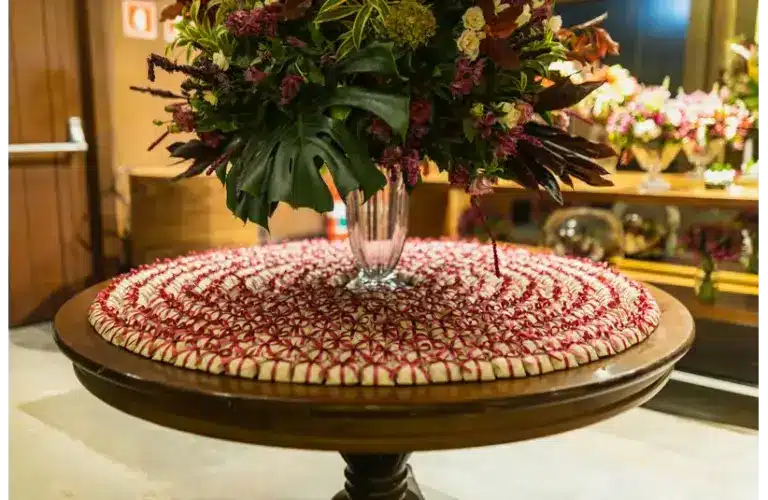 a beautiful valentine centerpiece on a table with a table mat