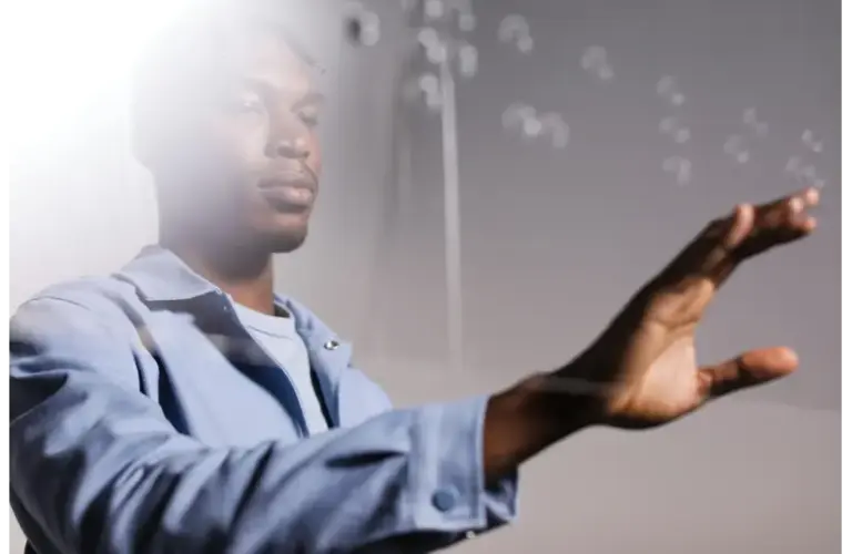 A person reaches out towards floating bubbles. Use of somatic tools.