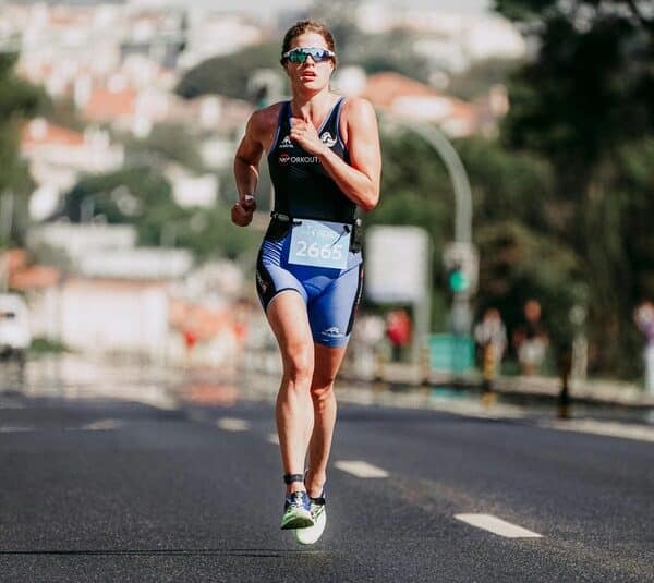 A woman runnng in a marathon. Performance for these events can come down to something as simple as gut health.