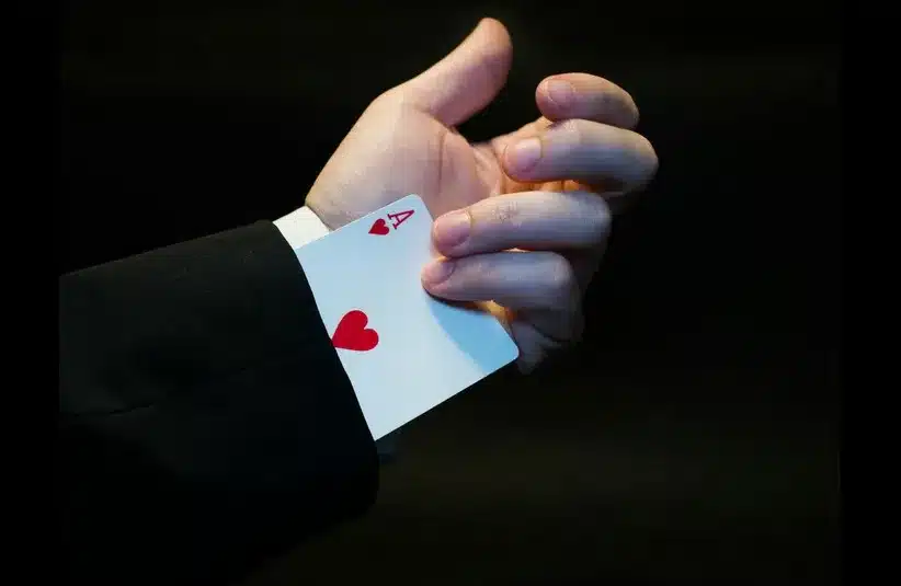 Daily devotion image shows magician with a hidden card coming out of his sleeve