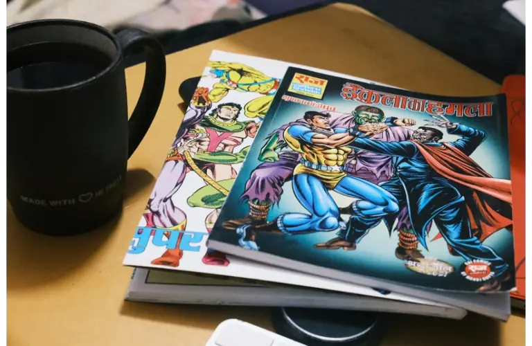 A stack of colorful comics featuring superheroes lies on a table next to a black coffee mug. The scene feels cozy and nostalgic.