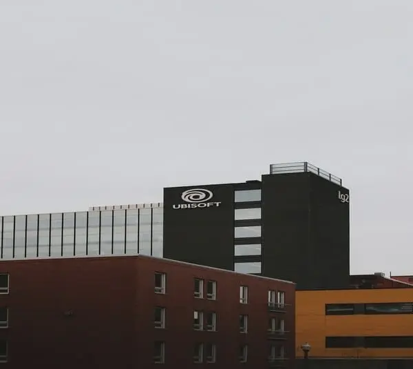 A building of Ubisoft near two other buildings, taken from a distance.