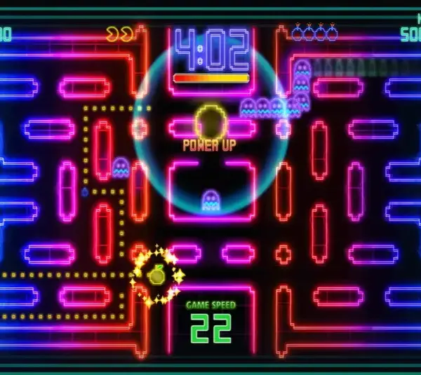 An image from Pac-Man Championship Edition DX, of Pac-Man racing through a neon maze.