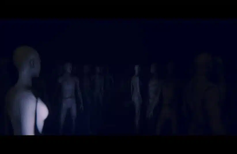Dark scene with numerous mannequin-like figures standing together, casting a mysterious, eerie atmosphere. Figures are dimly lit in bluish tones.