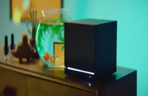 The Steam Machine sitting next to a fishbowl.