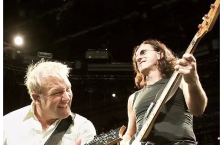 Rush Alex Lifeson & Geddy Lee performing on tour