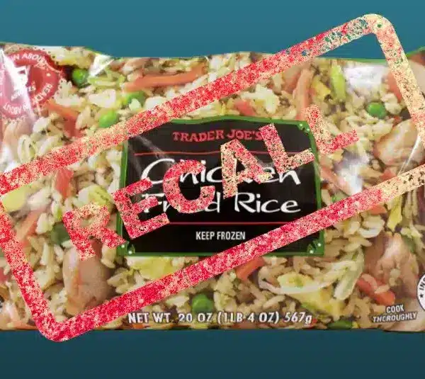 Packaged Trader Joe's Chicken Fried Rice against a blue background. A large red "RECALL" stamp overlays the image, indicating a recall notice.