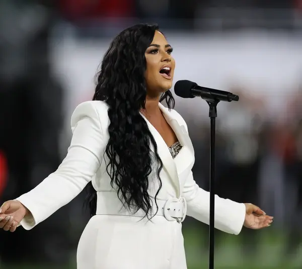 Feb 2, 2020; Miami Gardens, Florida, USA; Recording artist Demi Lovato performs the national anthem prior to the Kansas City Chiefs playing against the San Francisco 49ers in Super Bowl LIV at Hard Rock Stadium. Mandatory Credit: Matthew Emmons-Imagn Images