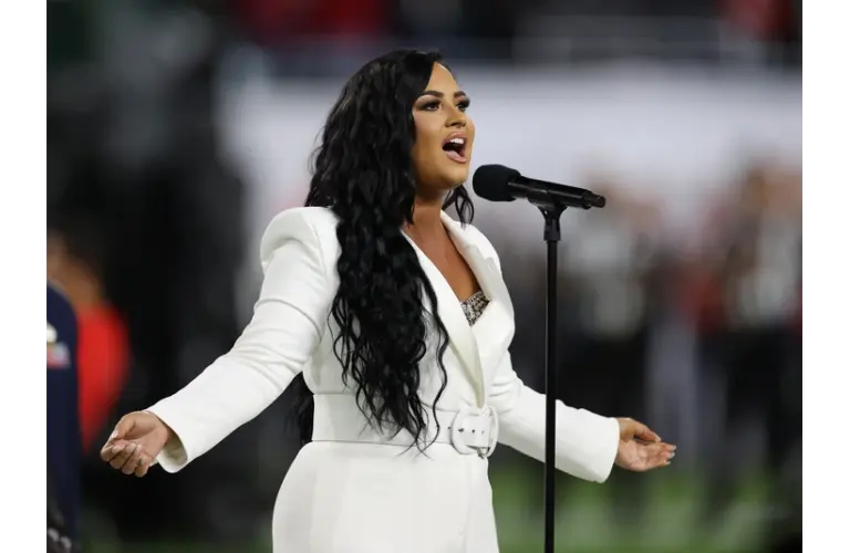 Feb 2, 2020; Miami Gardens, Florida, USA; Recording artist Demi Lovato performs the national anthem prior to the Kansas City Chiefs playing against the San Francisco 49ers in Super Bowl LIV at Hard Rock Stadium. Mandatory Credit: Matthew Emmons-Imagn Images