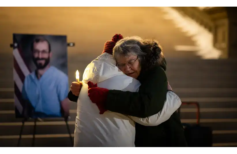 Nurses and other community members, including Ruelaine Stokes, right, and Chana Krau-Friedberg, both of Lansing, honor the late nurse Alex Pretti, Wednesday, Feb. 4, 2026, during a vigil at the state Capitol in Lansing. Pretti, an ICU nurse, was shot and killed by federal officers during a protest in Minneapolis last month. © Matthew Dae Smith/Lansing State Journal / USA TODAY NETWORK via Imagn Images