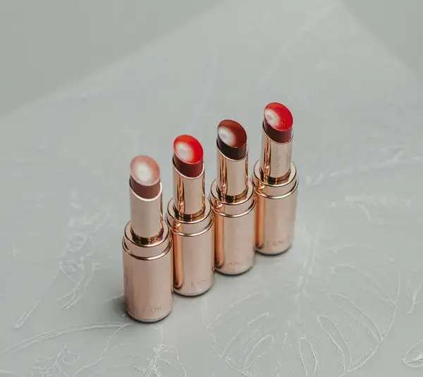 Different lip shades with a golden metal packing