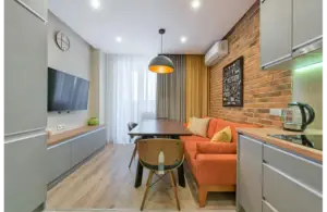 a small living area beautifully decored with sofas and curtains.