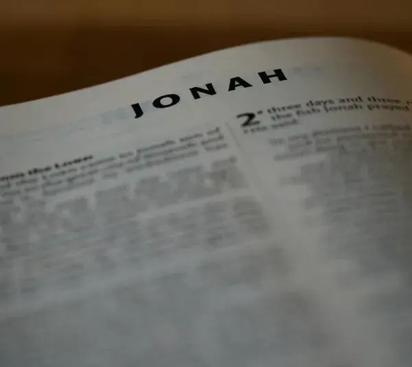 In Daily Devotion, Bible is open to Jonah.