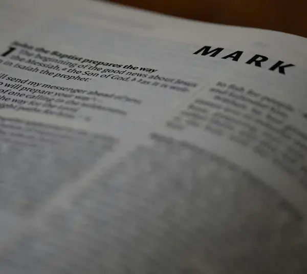 In daily devotion, a Bible is open to Mark.