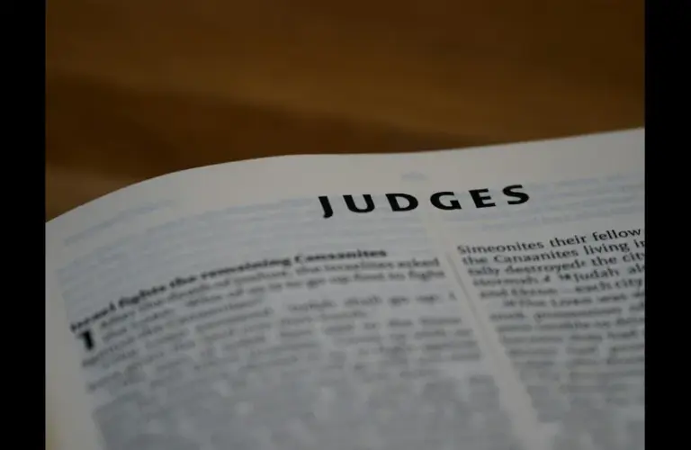 In daily devotion, a Bible is open to Judges.