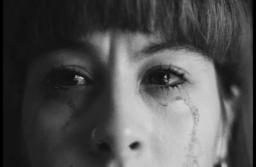 In daily devotion, a woman is tearful. 