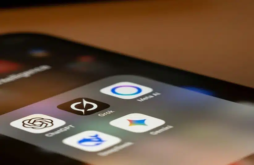Smartphone displays AI icons: Grok, ChatGPT, etc...