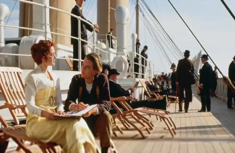 Jack and Rose on the deck of the Titanic, one of the best date movies.