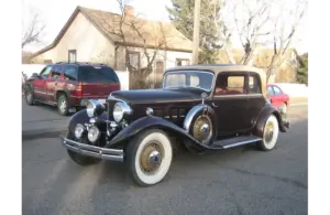 Image of 1931 Reo Royale Victoria Eight parked on the street in front of a house, REO Royale Eight