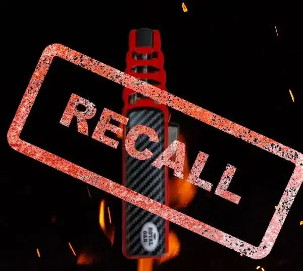 Image of Royal Oak Flame Saber Lighter on a black background with flames and the word Recall stamped over it