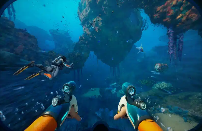 A vibrant underwater scene shows a person in a diving suit and flippers exploring a colorful aquatic landscape, surrounded by fish and coral formations. Subnautica 2, Krafton