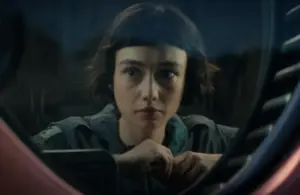 Sydney Chandler as Wendy looks out a window in "Alien Earth"