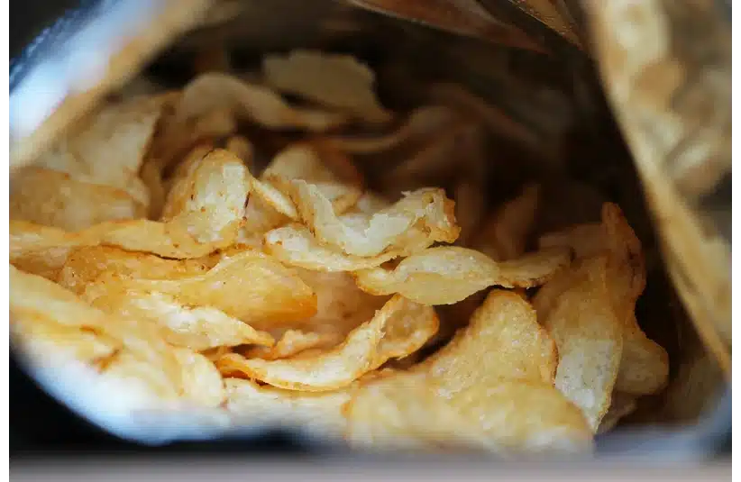 Image of a close up of an open bag of potato chips