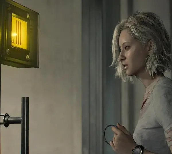 Grace looking at the Level 3 ID control panel in Emily room in Resident Evil Requiem