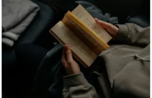 A person reading a book, possibly one from the impending book ban