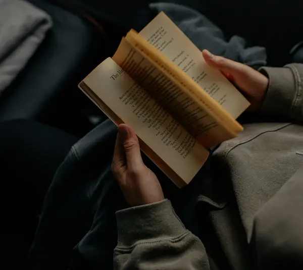 A person reading a book, possibly one from the impending book ban