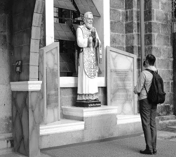 Image of a person praying at Padre Pio shrine, Diocesan Shrine and Parish of Our Lady of Light, Bonifacio Avenue, Cainta, Rizal, Philippines