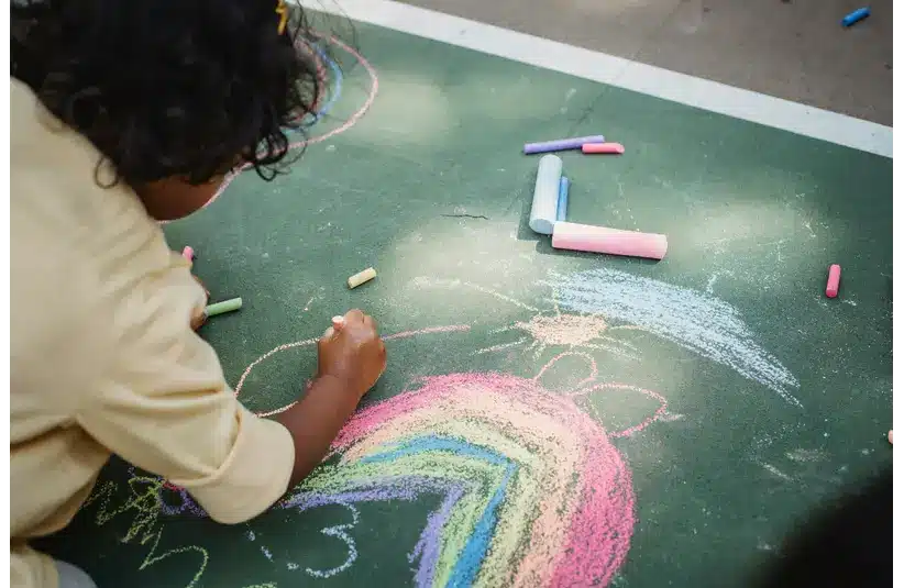 A child playing with chalk