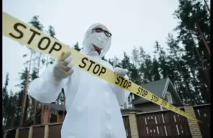 José Jurado Montilla - Man standing behind crime scene tape