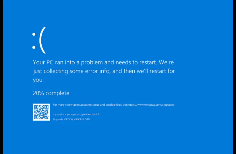 Windows Blue Screen of Death. Blue screen error displaying a sad face emoticon, message about a PC issue and restart, and progress at 20%, with a QR code on the lower left.