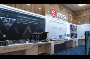 MSI product display showcases gaming hardware and "PRO MAX" series with illuminated signage and sleek, modern counter setups in a spacious room.