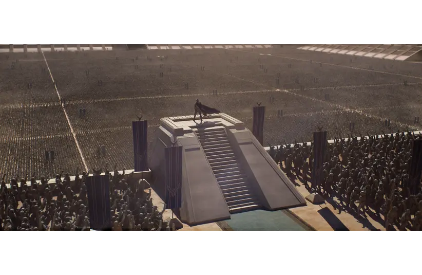 Large stone platform with stairs at the center of a vast arena, a lone figure stands on top, facing a sea of soldiers in orderly ranks, evoking a dramatic and epic tone from Dune: Part Three presented at CinemaCon 2026