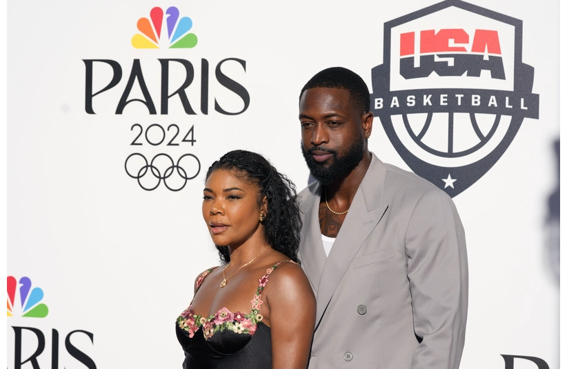 Aug 5, 2024; Paris, FRANCE; Dwyane Wade and wife Gabrielle Union pose for a photograph during the Paris 2024 Olympic Summer Games at Team USA House. Mandatory Credit: John David Mercer-Imagn Images