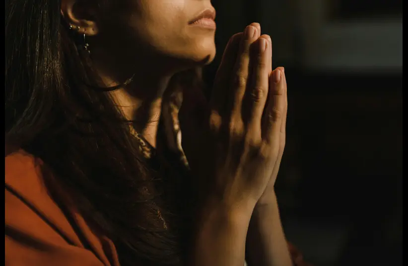 In daily devotional, a person is seeking God in prayer. 