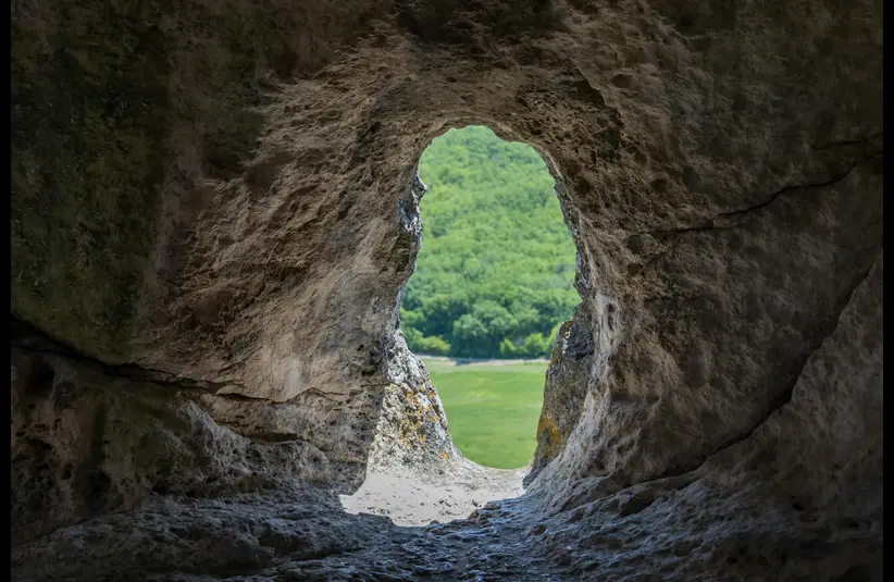 In the daily devotional, a open cave is shown that appears empty.